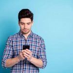 Why you should install smartphone updates as soon as possible Man on Smartphone