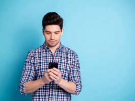 Why you should install smartphone updates as soon as possible Man on Smartphone